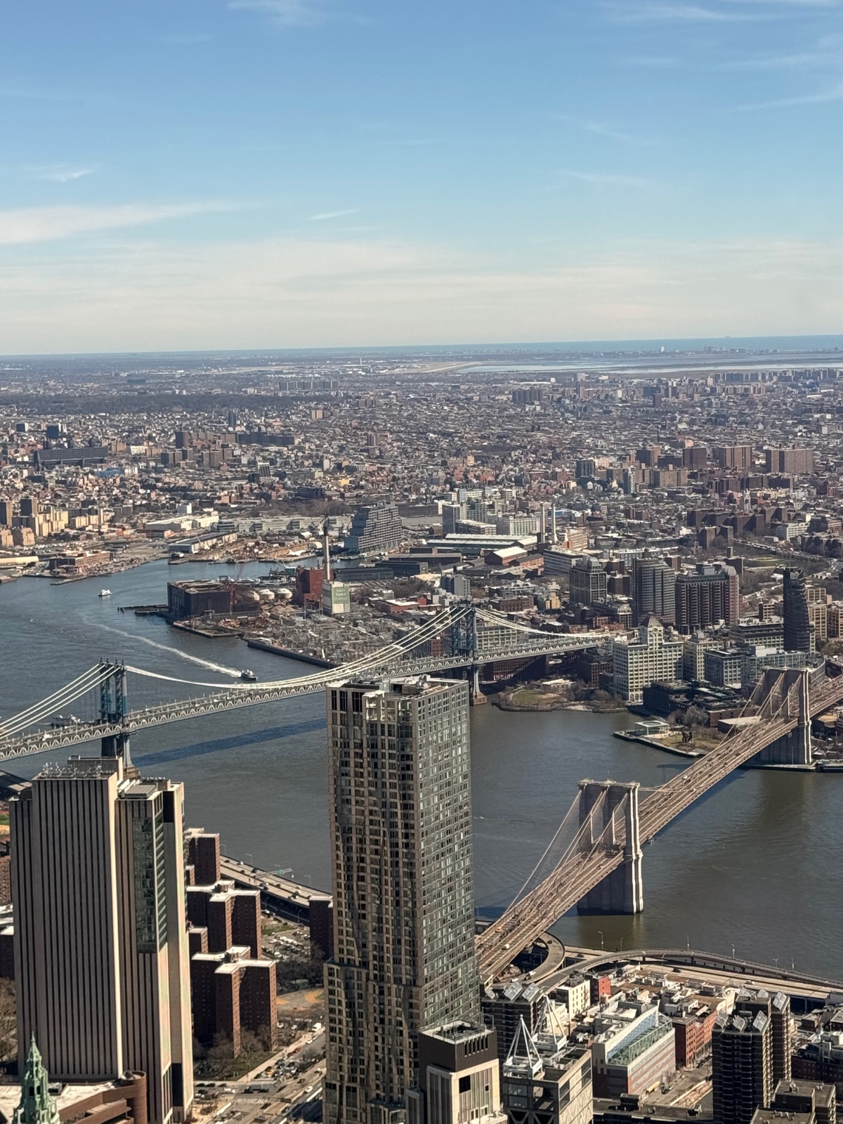 The Brooklyn Bridge and the Manhattan Bridge seen from directly above, crossing the East River into Brooklyn