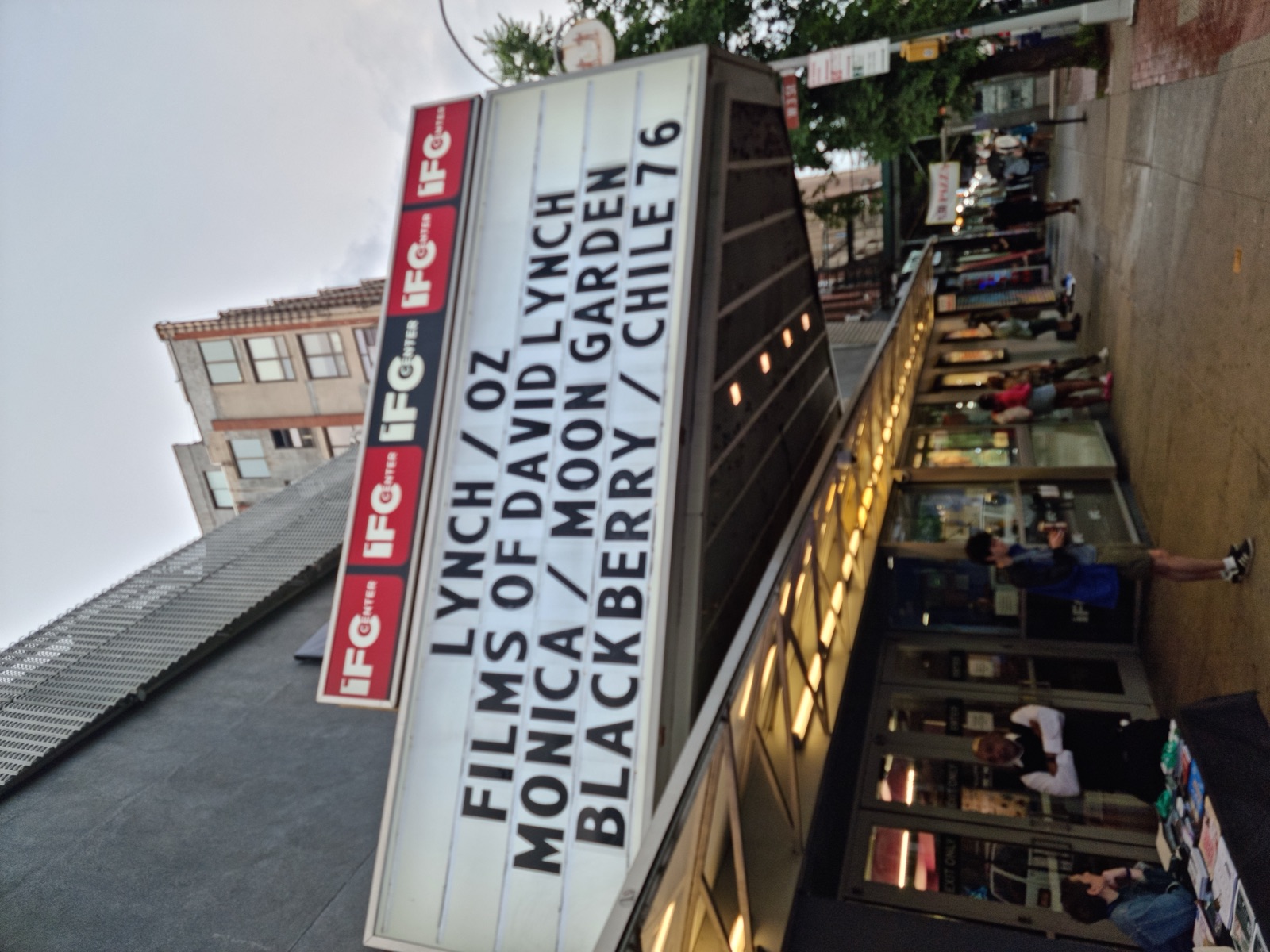The illuminated marquee of the IFC Center cinema reading LYNCH / OZ, FILMS OF DAVID LYNCH, MONICA / MOON GARDEN, BLACKBERRY / CHILE 76